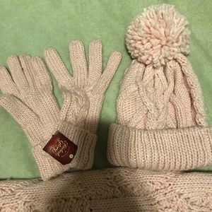 Knitted pink scarf, hat, and gloves